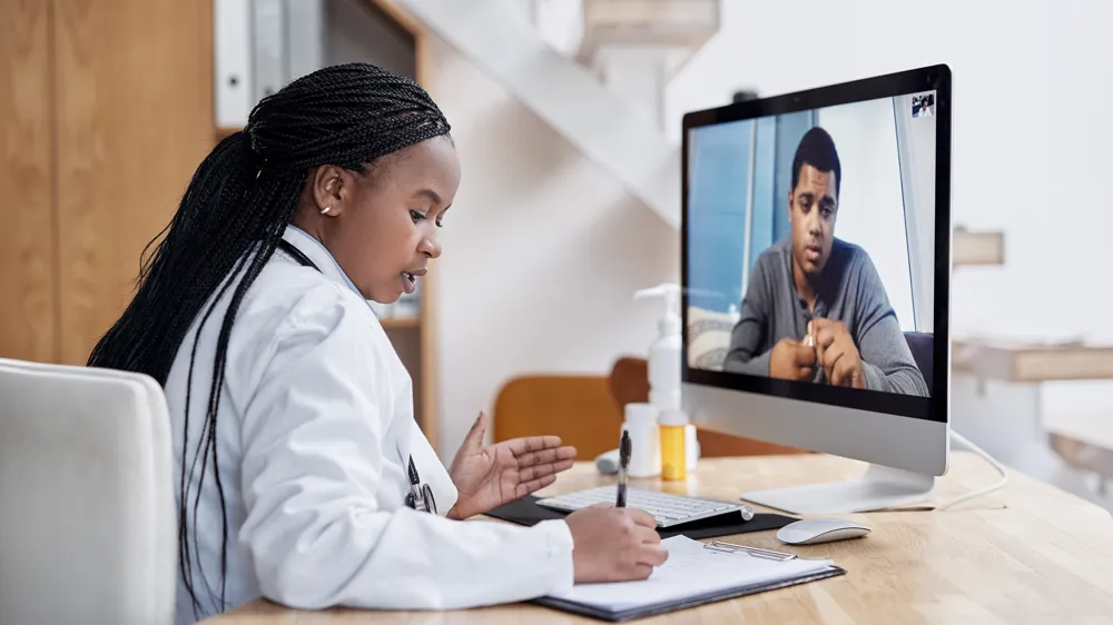 ALT Text: Medical Professional Speaking with a Patient through a virtual appointment