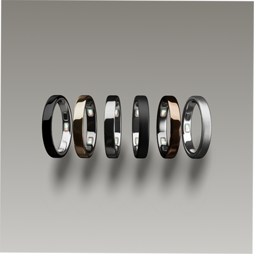 Six smart rings displayed in different finishes, featuring black, silver, and gold
