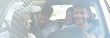 Young people riding in a ride share vehicle