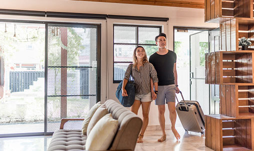 Couple entering their Airbnb