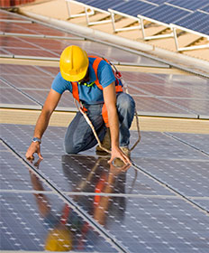 Man working on solar panels